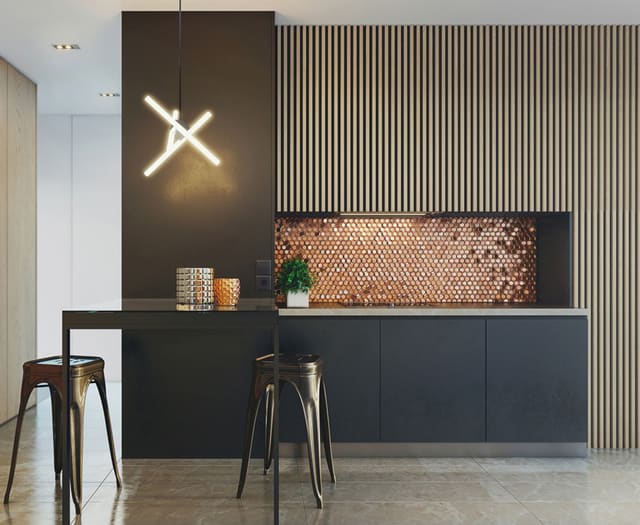 Everlasting modern kitchen with black cabinets and a wood slat accent wall