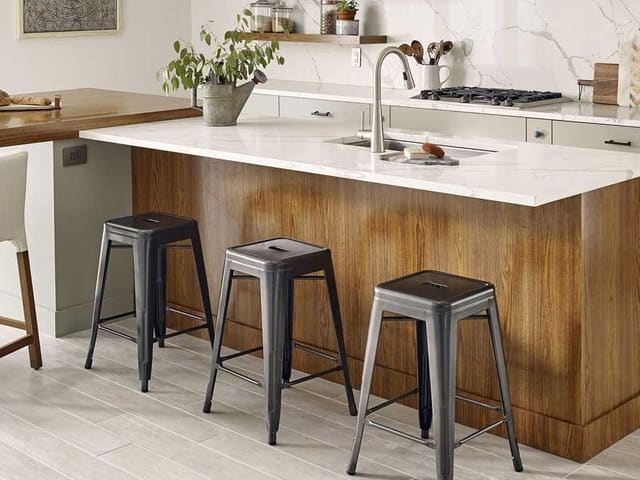 MSI Calacatta Laza quartz on a kitchen island with a wood base