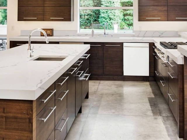 MSI Statuary Classique quartz in a white and walnut kitchen