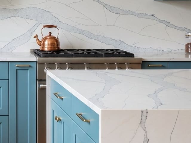 PentalQuartz Adera countertop with blue cabinets