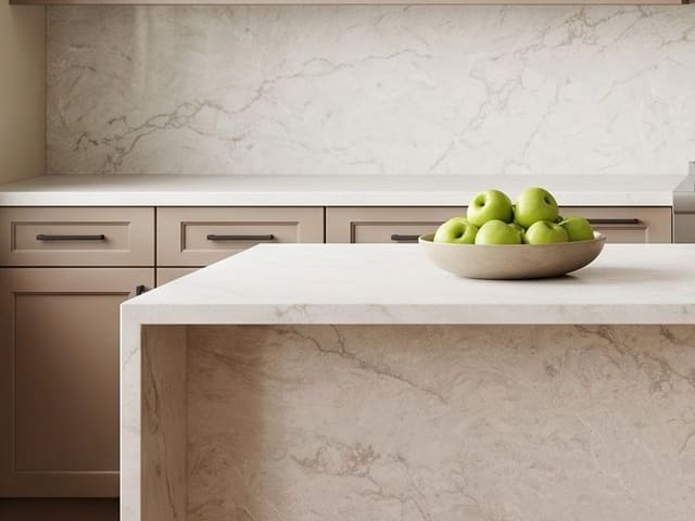 PentalQuartz Marestar countertop and waterfall island with taupe cabinets