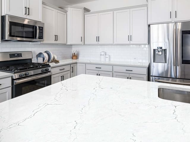 Spectrum Grandeur quartz in a bright white kitchen