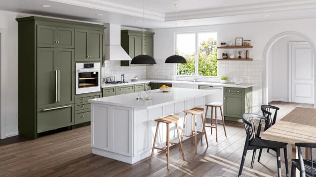 Forest green shaker cabinets with a white island, black pendant lights and wood counter stools