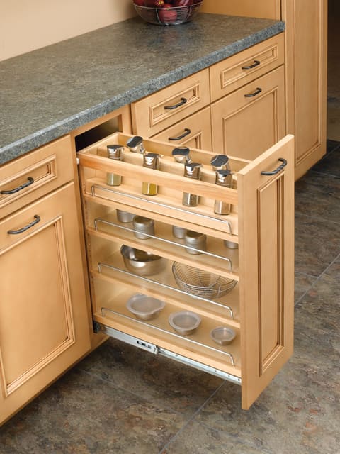 Narrow pull-out cabinet with spice jars and bowls
