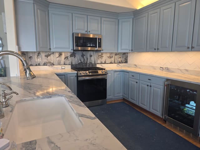 Raised panel cabinet doors with a beveled center panel, painted soft blue